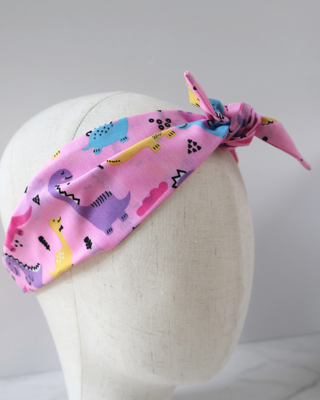 Retro Knotted Headband Pink Dinosaurs