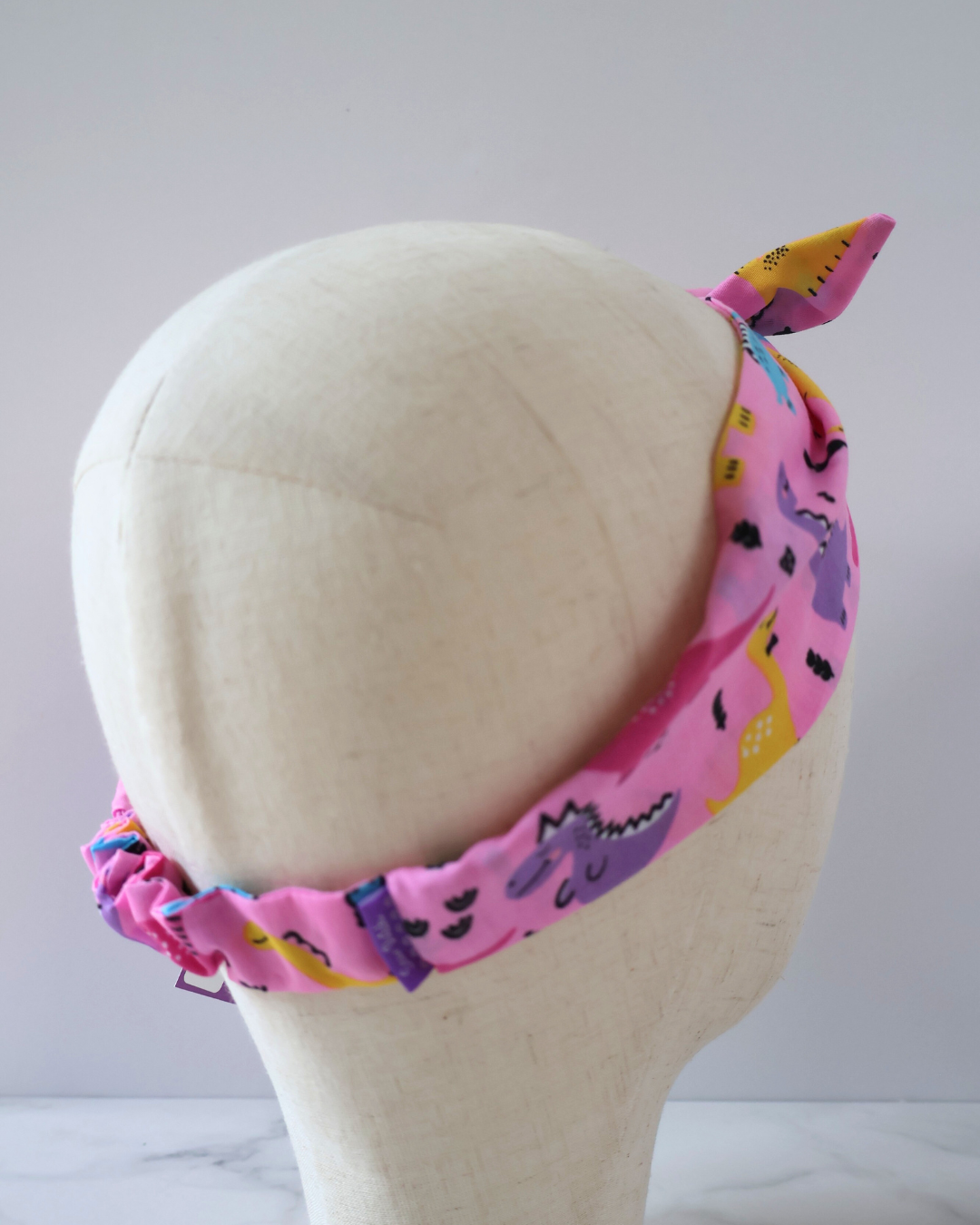 Retro Knotted Headband Pink Dinosaurs